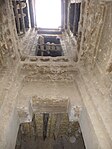 View from the lower levels up to the skylight that opens in the middle of the upper-floor patio, inside the main kasbah residence