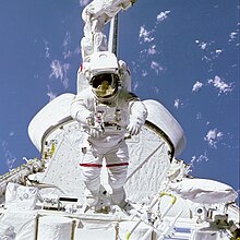 Bruce McCandless tests out the Remote Manipulator System foot restraint in the payload bay of Challenger during STS-41-B. McCandless on Arm in Aft Payload Bay - GPN-2000-001075.jpg