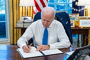 President Joe Biden signing Executive Order 14065 in the Oval Office. P20220221ES-0298-1 (51974425940).jpg