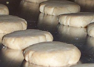 Fully cooked shortbread rounds on a baking sheet.