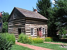 Thomas Isaac log cabin. Named after a 19th-century owner, the cabin was believed to have been built circa 1780 by an early Ellicott's Mills settler. This historic building has been closed and relocated while post-flood repairs on Main Street continue. Thomas Isaac Log Cabin, Ellicott City, Maryland.jpg