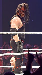 Kane after his second re-masking in 2014 WWE 2014-05-22 21-11-58 ILCE-6000 1840 DxO (14288608216).jpg