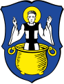 Gemeinde Amerdingen In Blau der golden nimbierte hl. Vitus in silbernem Gewand mit schwarzem Skapulier, der aus einem goldenen Ölkessel aufwächst.