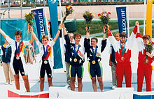 people standing and getting medals