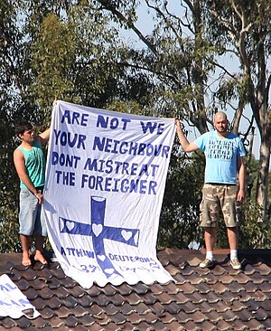 Asylum seekers protesting on the roof of the V...