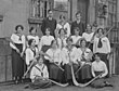 1915: Camogie team in Ireland posing with their hurleys/camáns