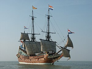 View of starboard side of three-masted sailing ship at sea with its lower sails raised