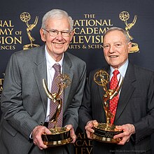 Peter Dillon and Albert Brault hold their Emmy statues, 2019