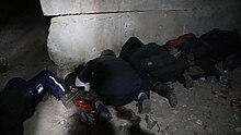 Executed civilians with wrists bound in plastic restraints, in a basement in Bucha, 3 April 2022 Misto Bucha pislia zvil'nennia vid rosiis'kikh okupantiv.jpg