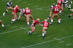 Frank Gore (21) of the San Francisco 49ers tak...