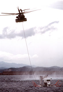 An MH-53E from HM-15 tows a minesweeping sled while conducting simulated mine clearing operations MH-53E Sea Dragon towing sled.jpg