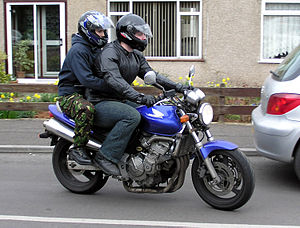 Rider with pillion on a Honda CB600F