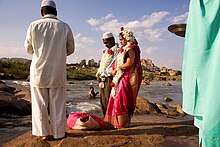 A Muslim couple being wed alongside the Tungabhadra River at Hampi, India Muslim wedding in India.jpg