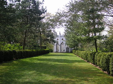The Gothic Temple is at the end of an avenue of pines and hedges.