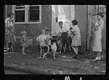 Children playing on sidewalk in Georgetown during the Great Depression, photographed by Carl Mydans in 1935 Poor children playing on sidewalk, Georgetown, Washington, D.C. Digital ID- (digital file from original neg.) fsa 8a00156 http- hdl.loc.gov loc.pnp fsa.8a00156.jpg
