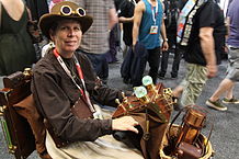 Cosplayer using a steampunk-dressed electric wheelchair during San Diego Comic Con