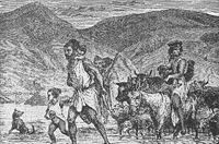 A Berber family crossing a ford - scene in Algeria. Berbers are the indigenous peoples of North Africa west of the Nile Valley.