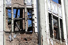 War damage on a Sarajevo building Siege-Shattered Facade - Sarajevo - Bosnia and Herzegovina.jpg