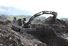 The AEV 3 Kodiak has an articulated excavator arm and bulldozer blade among its adaptations for obstruction removal. AEV3 5.jpg