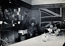 A soldier in a military hospital in Harrow, London, with a Union Jack displayed in the right background, 1922 A soldier sitting in a room in a military hospital in Harrow Wellcome V0029742.jpg