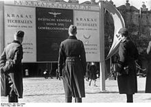Krakow, 1941. Announcement of an art exhibition in the Sukiennice Cloth Hall: "How German artists see the General Government" Bundesarchiv Bild 183-L24355, Krakau, Ankundigung einer Kunstausstellung.jpg