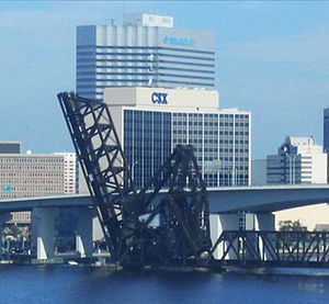 CSX's headquarters in Jacksonville, Florida, with the Acosta Bridge and adjacent Florida East Coast Railway bridge in the foreground.