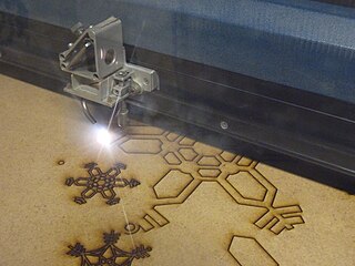 http://commons.wikimedia.org/wiki/File:Laser_cutting_snowflakes.jpg
