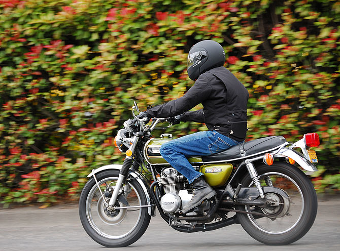 A panned shot of a motor cycle