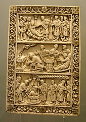 Late Carolingian ivory relief, c. 870, showing both the two different legends of the origins of the Sainte Ampoule. In the middle two vials are filled by the Hand of God, as the "moribund pagan" waits to the right. At bottom the dove of the Holy Spirit delivers the filled ampoule for the baptism of Clovis I. Musee Picardie Medieval 01.jpg