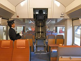 Retractable ladder providing access to the raised driver's cab