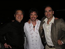 Downey Jr. with William Cheung and Eric Oram (2005) Oram with Downey Jr and Cheung 2005.jpg