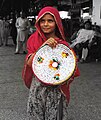 A girl selling traditional Sindhi Pindi/Dabeki