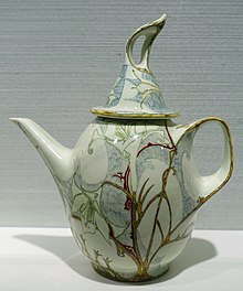 Rozenburg teapot by J. Jurriaan Kok (form) & Samuel Schellink (decoration), 1900, porcelain Teapot by J. Jurriaan Kok (form) & J. Schellink (decoration), Haagsche Plateelbakkerij, Rozenburg, Den Haag, 1900, porcelain - Hessisches Landesmuseum Darmstadt - Darmstadt, Germany - DSC00816 (cropped).jpg