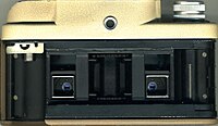 View of the back of the camera with the film chamber visible. With the selector in the A position, the lenses are pointing to the bottom half of the film.