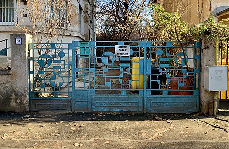 Gate decorated with simple geometric shapes of Strada Doctor Lister no. 11, Bucharest, Romania, unknown architect (c.1930), inspired by the geometry found in Futurist and Constructivist art