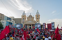 A 2012 rally by members of the left-wing populist United Socialist Party of Venezuela in Maracaibo Acto de Posesion del Gobernador Arias Cardenas.jpg