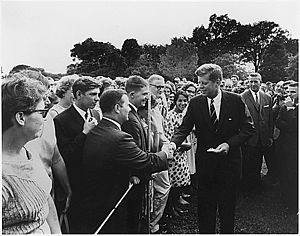 John F. Kennedy greets volunteers on August 28...