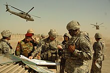 Austin during the Iraq War on September 11, 2007 Meeting in East Baghdad DVIDS59092.jpg