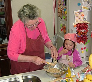 Taste-testing the cookie dough with Grandm