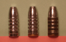 Cast bullets as cast (left), with gas check (center) and lubricated (right). 3CastBullets.png