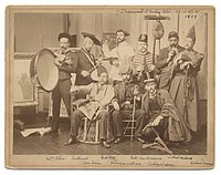 Artists in costume at the Sherwood Studio Building in New York, 1889. Watrous is seated at center.
