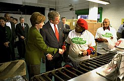U.S. President George W. Bush visits the Capital Area Food Bank's Washington warehouse in 2002.
