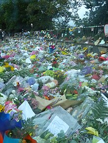 Flower wall memorial erected after mass-shootings in March 2019 targeting Al-Noor Mosque and Linwood Islamic Centre in Christchurch City, New Zealand. The terrorist attack was motivated by far-right extremism and resulted in 51 deaths. Christchurch mosque shootings memorial flower wall.jpg