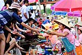 Hawker selling food to customer, Khlong Hae floating market, southern Thailand