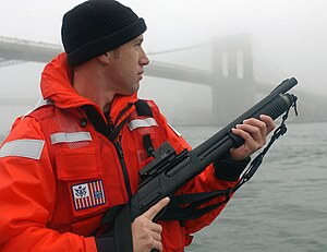 A U.S. Coast Guard petty officer from Maritime Safety and Security Team 91106 armed with an Mk870P fitted with a Trijicon RX01 reflex sight and a Speedfeed stock Maritime Safety & Security Team (MSST) 91106.jpg