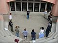 A view of the Rome Campus theater from the audience looking onto the stage, with student actors rehearsing, Spring 2002