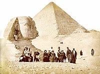 Auguste Mariette (seated, far left) and Pedro II of Brazil (seated, far right) with others during the Emperor's visit to the Giza pyramid complex at the end of 1871