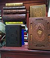 A collection of luxurious Qurans and other holy books