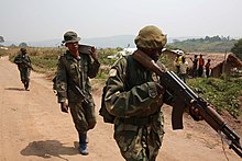 FARDC soldiers on patrol near Aveba in 2015 Aveba, district de l'Ituri, Province Orientale, DR Congo - Des militaires FARDC en patrouille. (16643921095).jpg