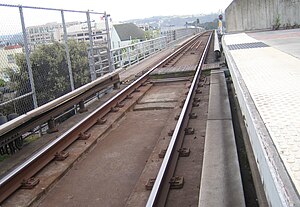 A picture showing the third rails on either si...